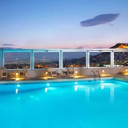 Divani Caravel Афіни Екстер'єр фото The pool at the hotel